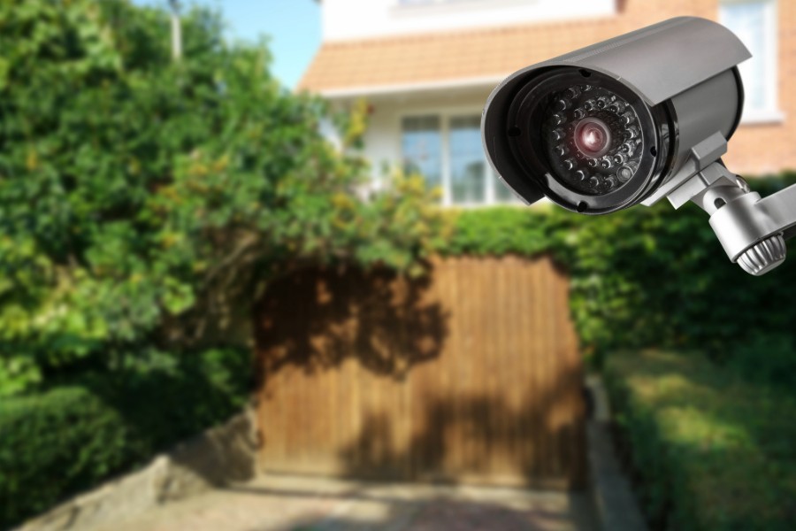 Security camera mounted outside a house.