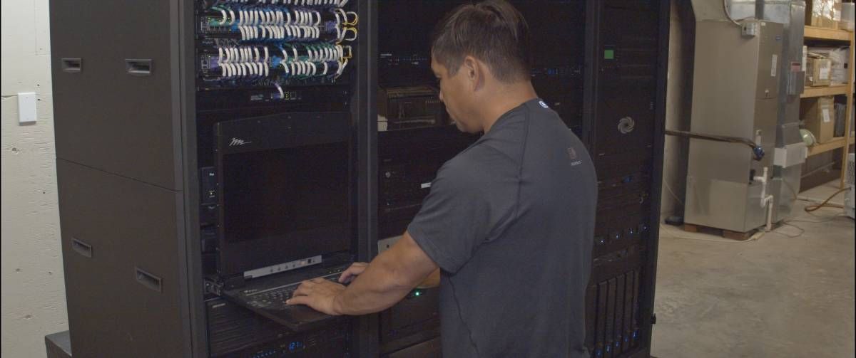 Encore Employee working on a server