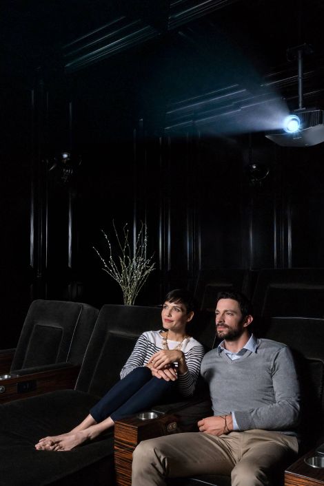 Couple sitting in home theater